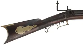 Antique Target Rifle
.48 caliber, 31" heavy barrel,
walnut stock, silver trim, peep sight, 
by A. Leonard, Saxon River, Vermont
